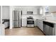 This eat-in kitchen features stainless steel appliances, light gray cabinets, and granite countertops at 2425 Park Ave, Austell, GA 30106
