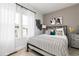 Serene bedroom with a comfortable bed, neutral decor, large window and a modern nightstand at 2656 Brookview Nw Ln, Atlanta, GA 30318