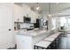 Modern kitchen with a large island, sleek countertops, stainless steel appliances and seating for four at 2656 Brookview Nw Ln, Atlanta, GA 30318