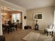 Bright dining room with a chandelier and view into the living room at 730 Donner Ct, Mcdonough, GA 30252