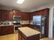 Island kitchen with stainless steel appliances and granite countertops at 730 Donner Ct, Mcdonough, GA 30252