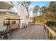 Backyard deck featuring a porch swing, outdoor seating, and a grill, perfect for relaxing or entertaining at 85 Sara Dr, Covington, GA 30016