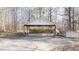 Large carport and covered area, providing ample parking and storage, with a shed nearby at 85 Sara Dr, Covington, GA 30016