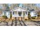 Charming single-story home with a covered front porch and manicured landscaping at 85 Sara Dr, Covington, GA 30016