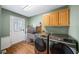 Spacious laundry room featuring modern appliances and ample storage at 85 Sara Dr, Covington, GA 30016