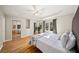 Tranquil main bedroom with tray ceilings, hardwood floors and abundant closet space at 85 Sara Dr, Covington, GA 30016