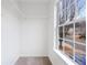 Walk-in closet with window and shelving at 132 Timber Mist Ln, Lawrenceville, GA 30045