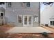 Private patio with double doors leading to the house at 132 Timber Mist Ln, Lawrenceville, GA 30045