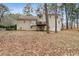 House backyard with deck and wooded area at 2020 Temple Johnson Rd, Loganville, GA 30052