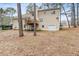House backyard with deck and wooded area at 2020 Temple Johnson Rd, Loganville, GA 30052