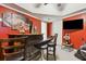 Basement bar with seating and a wall-mounted TV at 2020 Temple Johnson Rd, Loganville, GA 30052