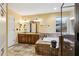 Bathroom boasts double sinks, a soaking tub and separate shower at 2020 Temple Johnson Rd, Loganville, GA 30052