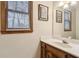 Clean bathroom with wood vanity and a large mirror at 2020 Temple Johnson Rd, Loganville, GA 30052