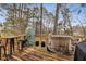 Deck with wooded views, grill, and small table and chairs at 2020 Temple Johnson Rd, Loganville, GA 30052