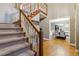 Two-story entryway with hardwood floors and view of dining room at 2020 Temple Johnson Rd, Loganville, GA 30052