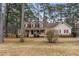 Two-story house with a wraparound porch and landscaped yard at 2020 Temple Johnson Rd, Loganville, GA 30052