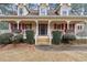 House exterior with a large front porch and landscaping at 2020 Temple Johnson Rd, Loganville, GA 30052