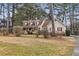 Two-story house with a wraparound porch and landscaped yard at 2020 Temple Johnson Rd, Loganville, GA 30052