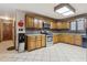 Large kitchen with wood cabinets, granite countertops, and stainless steel appliances at 2020 Temple Johnson Rd, Loganville, GA 30052
