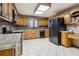 Spacious kitchen with wood cabinets, granite countertops, and stainless steel appliances at 2020 Temple Johnson Rd, Loganville, GA 30052