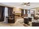 Living room with fireplace, leather furniture, and hardwood floors at 2020 Temple Johnson Rd, Loganville, GA 30052