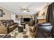 Relaxing living room with fireplace and leather furniture at 2020 Temple Johnson Rd, Loganville, GA 30052
