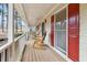 Front porch with rocking chairs and view of wooded area at 2020 Temple Johnson Rd, Loganville, GA 30052