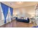 Living room with dark hardwood floors and a blue velvet sofa at 5858 Savannah River, Atlanta, GA 30349