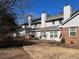 Exterior shot of backyard featuring a patio and mature trees at 5950 Wintergreen Rd, Norcross, GA 30093