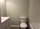 Clean bathroom featuring a toilet and bathtub at 5950 Wintergreen Rd, Norcross, GA 30093
