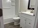 Clean bathroom with white vanity, shower, and toilet at 5950 Wintergreen Rd, Norcross, GA 30093