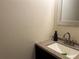 Small bathroom with vanity, mirror and granite countertop at 5950 Wintergreen Rd, Norcross, GA 30093