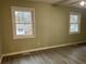 Bright bedroom with new flooring and large window at 5950 Wintergreen Rd, Norcross, GA 30093