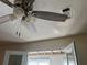 Modern ceiling fan with light fixture in a sunroom at 5950 Wintergreen Rd, Norcross, GA 30093