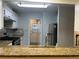 Kitchen with granite countertops and breakfast bar at 5950 Wintergreen Rd, Norcross, GA 30093