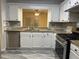 Kitchen features granite countertops and stainless steel appliances at 5950 Wintergreen Rd, Norcross, GA 30093