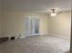 Spacious living room with french doors and hardwood floors at 5950 Wintergreen Rd, Norcross, GA 30093