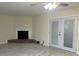 Living room with fireplace and french doors at 5950 Wintergreen Rd, Norcross, GA 30093