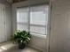 Sunroom featuring large windows with blinds and a peaceful atmosphere at 5950 Wintergreen Rd, Norcross, GA 30093