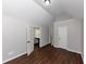 Spacious bedroom with hardwood floors and neutral walls, two doors at 7502 Springbox Dr, Fairburn, GA 30213