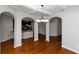 Bright dining room with hardwood floors and chandelier at 7502 Springbox Dr, Fairburn, GA 30213