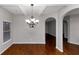 Dining room with hardwood floors and chandelier at 7502 Springbox Dr, Fairburn, GA 30213