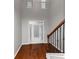 Bright entryway with hardwood floors and staircase at 7502 Springbox Dr, Fairburn, GA 30213