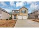 Two-story house with a two-car garage and landscaped lawn at 7502 Springbox Dr, Fairburn, GA 30213