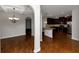 Open kitchen with granite countertops and stainless steel appliances at 7502 Springbox Dr, Fairburn, GA 30213
