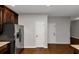 Kitchen boasts stainless steel refrigerator and dark wood cabinets at 7502 Springbox Dr, Fairburn, GA 30213