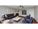 Living room features hardwood floors, fireplace, and plenty of natural light at 7502 Springbox Dr, Fairburn, GA 30213