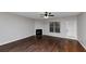 Living room with hardwood floors and corner fireplace at 7502 Springbox Dr, Fairburn, GA 30213