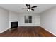 Spacious living room with hardwood floors and fireplace at 7502 Springbox Dr, Fairburn, GA 30213