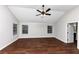 Main bedroom with hardwood floors, high ceilings, and two windows at 7502 Springbox Dr, Fairburn, GA 30213
